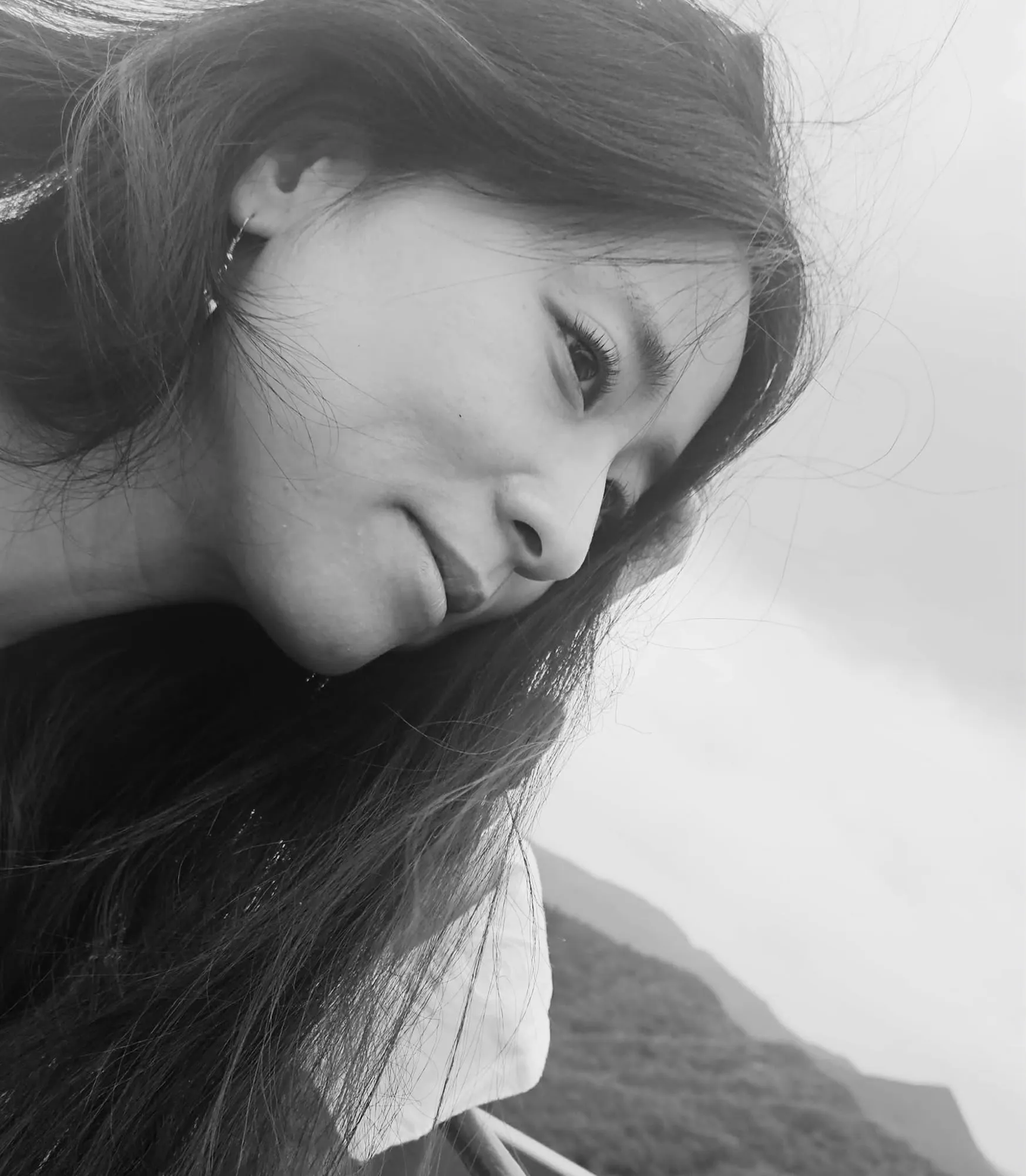 Doa, founder and practitioner of SOLTHA — a quiet portrait against the Jeju sea