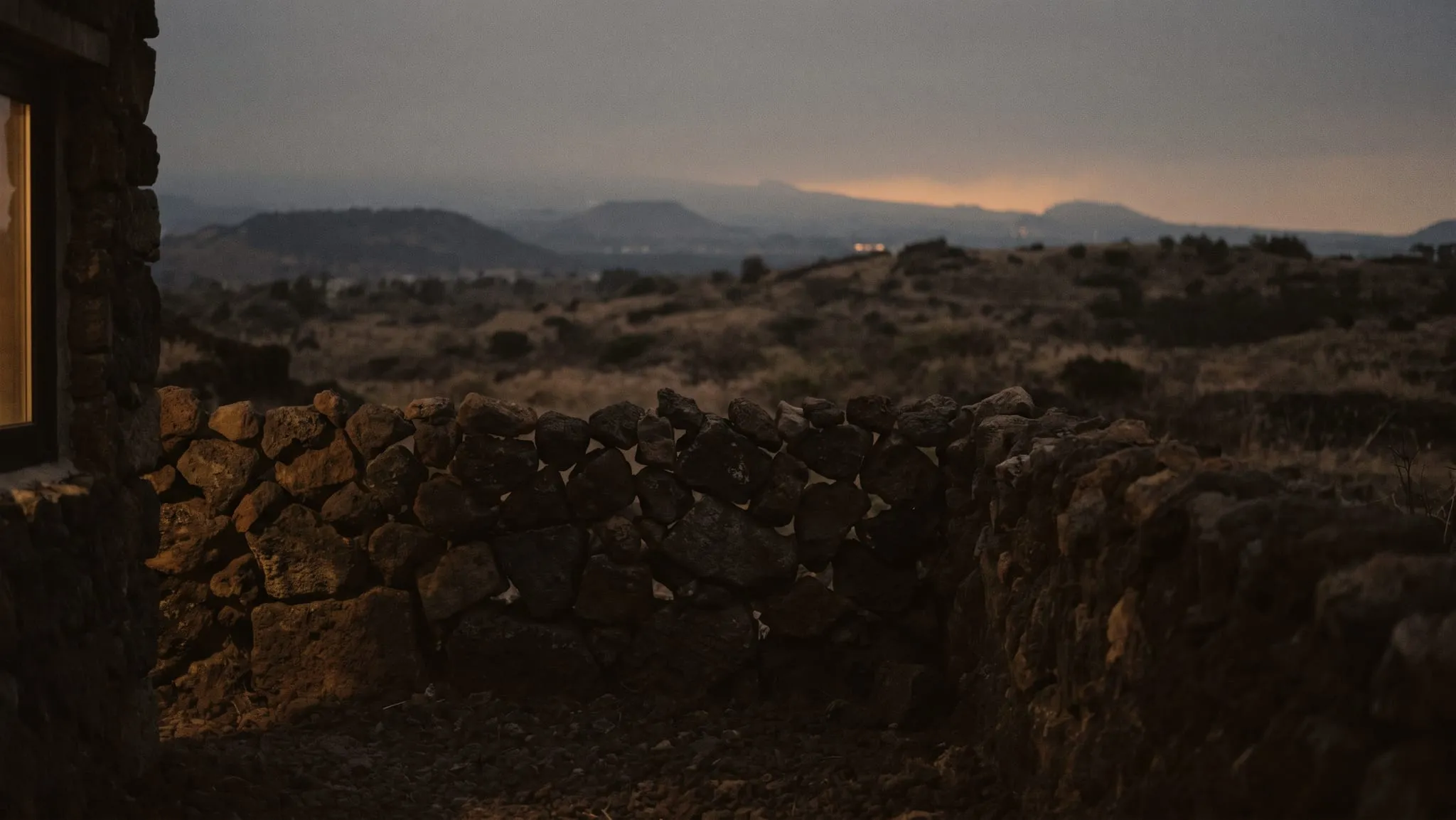 Evening over Jeju — the sky in bands of ember and slate